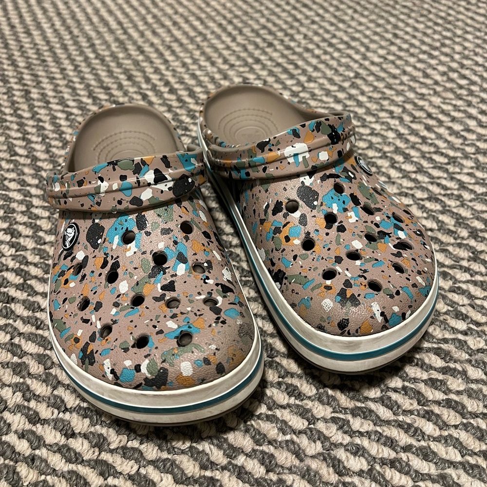 Women’s 8 & Men’s 6 Crocs! tan with colorful design.